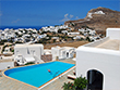 View of the Chora village and the church of Panagia and the swimming pool of the Solaris hotel in Folegandros island, Cyclades, Greece