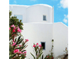 A stoned whitewashed room of the Solaris hotel on Folegandros island, Cyclades, Greece, under the unique Aegean light that reflects the Cycladic architectural spirit