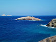 Agios Georgios church on the top of the tiny dry island close to Livadi beach in Folegandros island, Cyclades, Greece”